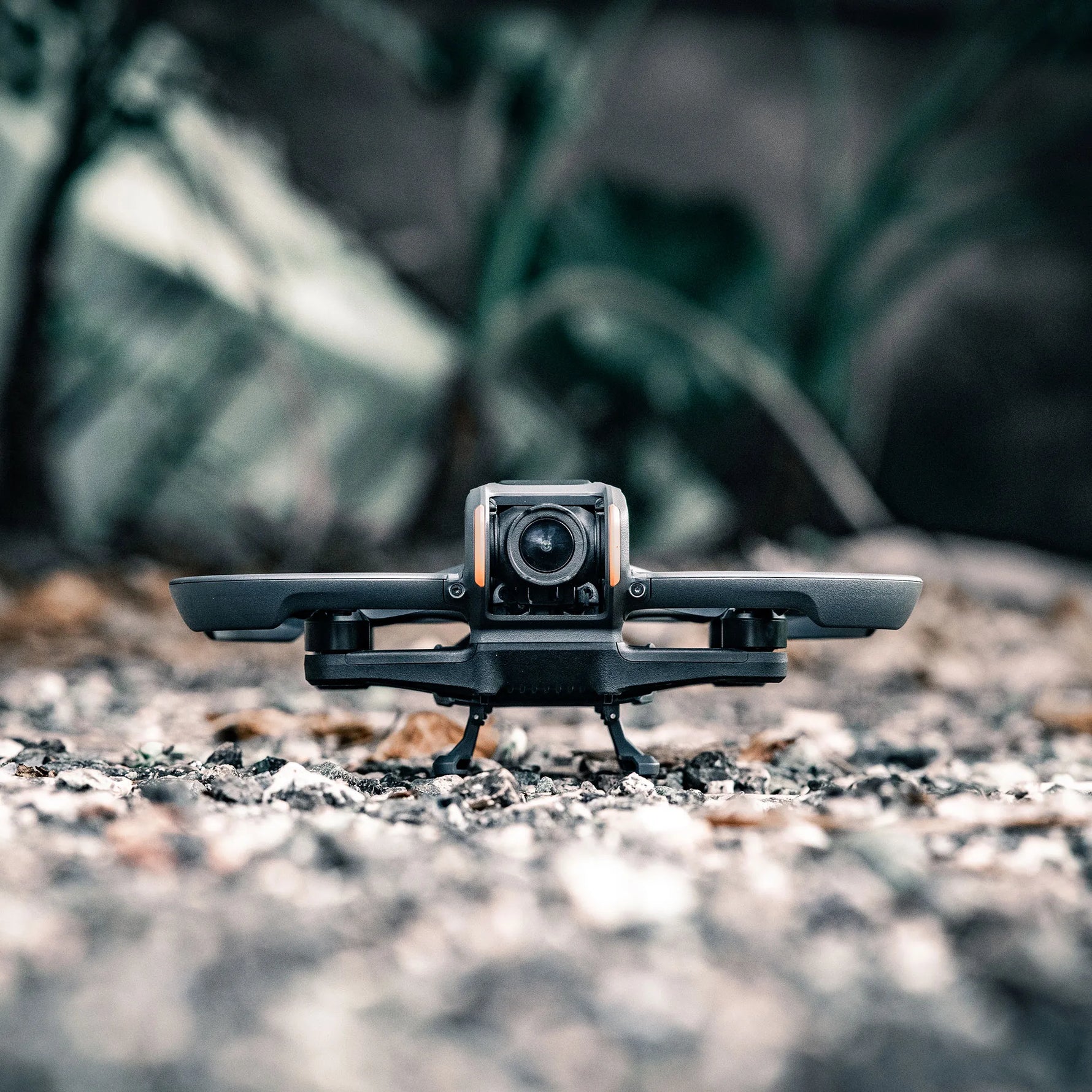 DJI Avata 2 landed safely on rough gravel terrain using the STARTRC landing gear extension to prevent scratches and dirt.