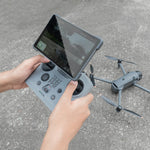 First-person view of holding the DJI RC PRO 2 remote, showcasing the soft skin-like feel and ergonomic anti-slip grip of the silicone cover.