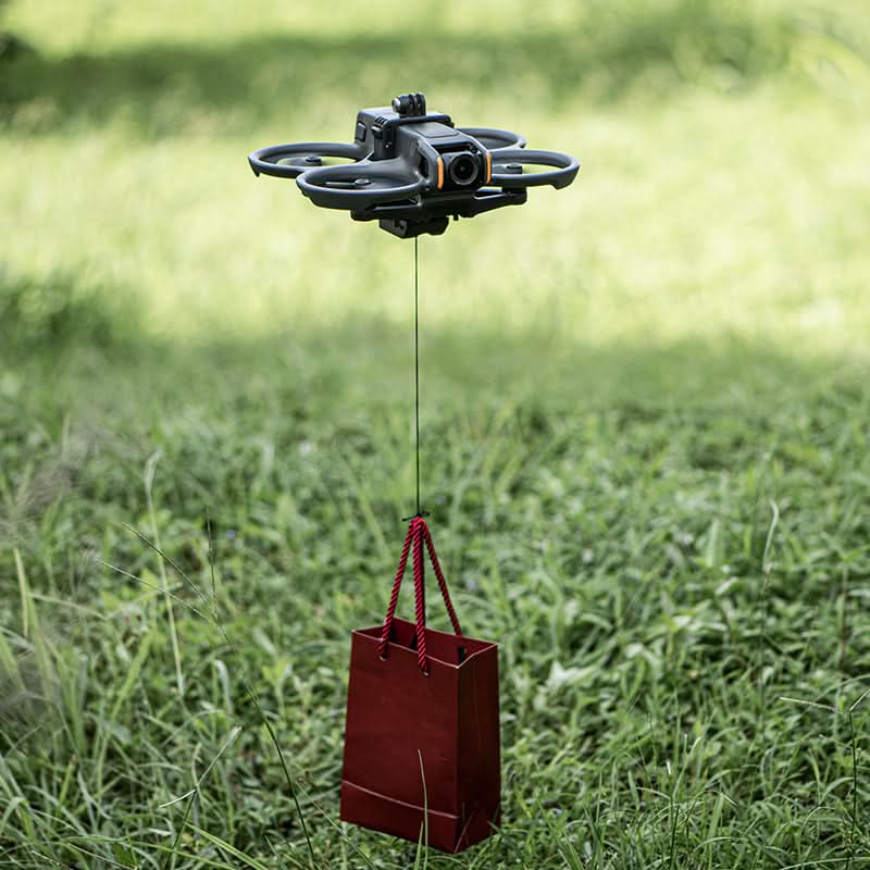 A DJI Avata 2 drone demonstrating the 200g high load-bearing capacity of the STARTRC mount during a vertical lift test.
