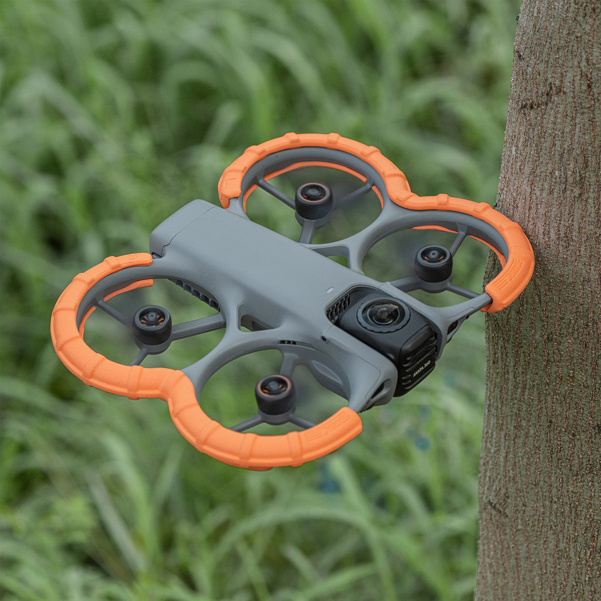 DJI Avata 360 drone bouncing off a tree safely. STARTRC EVA bumper guards act as an airbag to shield the motor axis and drone body from impacts.