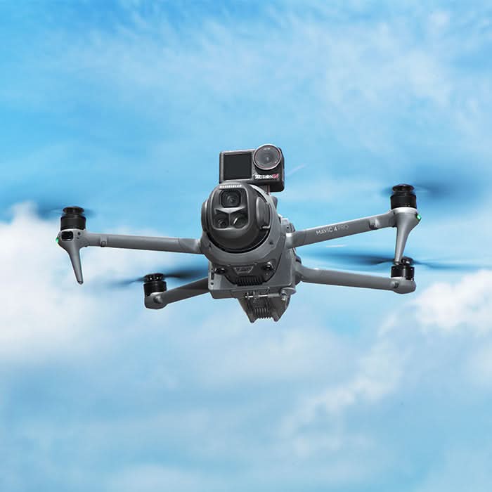 Aerial view of the DJI drone flying smoothly against a blue sky, carrying the smart airdrop system and an action camera without impacting obstacle avoidance.