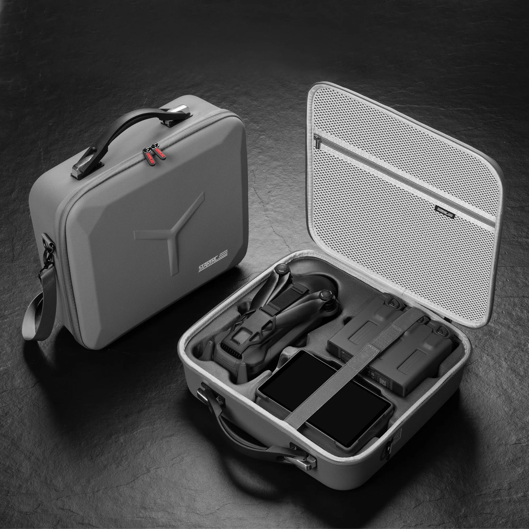 Two protective carrying cases for DJI aerial equipment, showcasing both the compact exterior and the secure interior storage capacity.