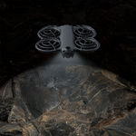 DJI Neo 2 navigating a dark environment using the STARTRC LED landing gear to enhance flight visibility and avoid obstacles during night flights.