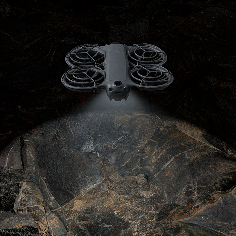 DJI Neo 2 navigating a dark environment using the STARTRC LED landing gear to enhance flight visibility and avoid obstacles during night flights.