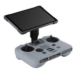 The DJI RC PRO 2 remote with the screen unfolded, demonstrating how the flexible silicone protector allows full, unhindered operation of the device.