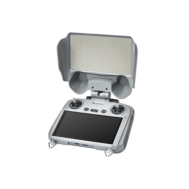 Grey 3-in-1 sun hood and screen protector installed on a DJI RC2 remote controller, blocking UV rays for clear outdoor flight visibility.