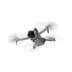Compact camera drone flying outdoors equipped with an ND filter, boosting footage clarity and minimizing color distortion in bright conditions.