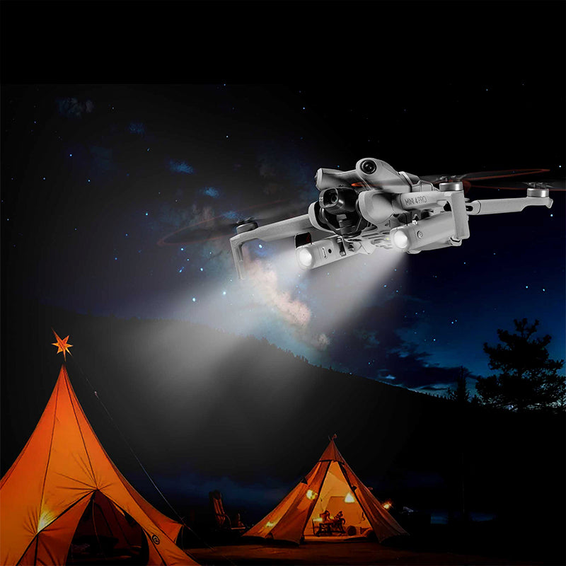 Drone hovering and illuminating a dark campsite with its powerful LED lights, a perfect accessory for creative night shoots and adventures.