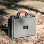 IP67 waterproof and dustproof drone hard case resting on rugged forest terrain, providing reliable real-world durability for professional aerial filmmakers.