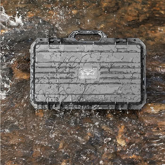 Multi-compatible drone travel case resting on wet outdoor rocks, proving its reliable waterproof protection against moisture and extreme weather.