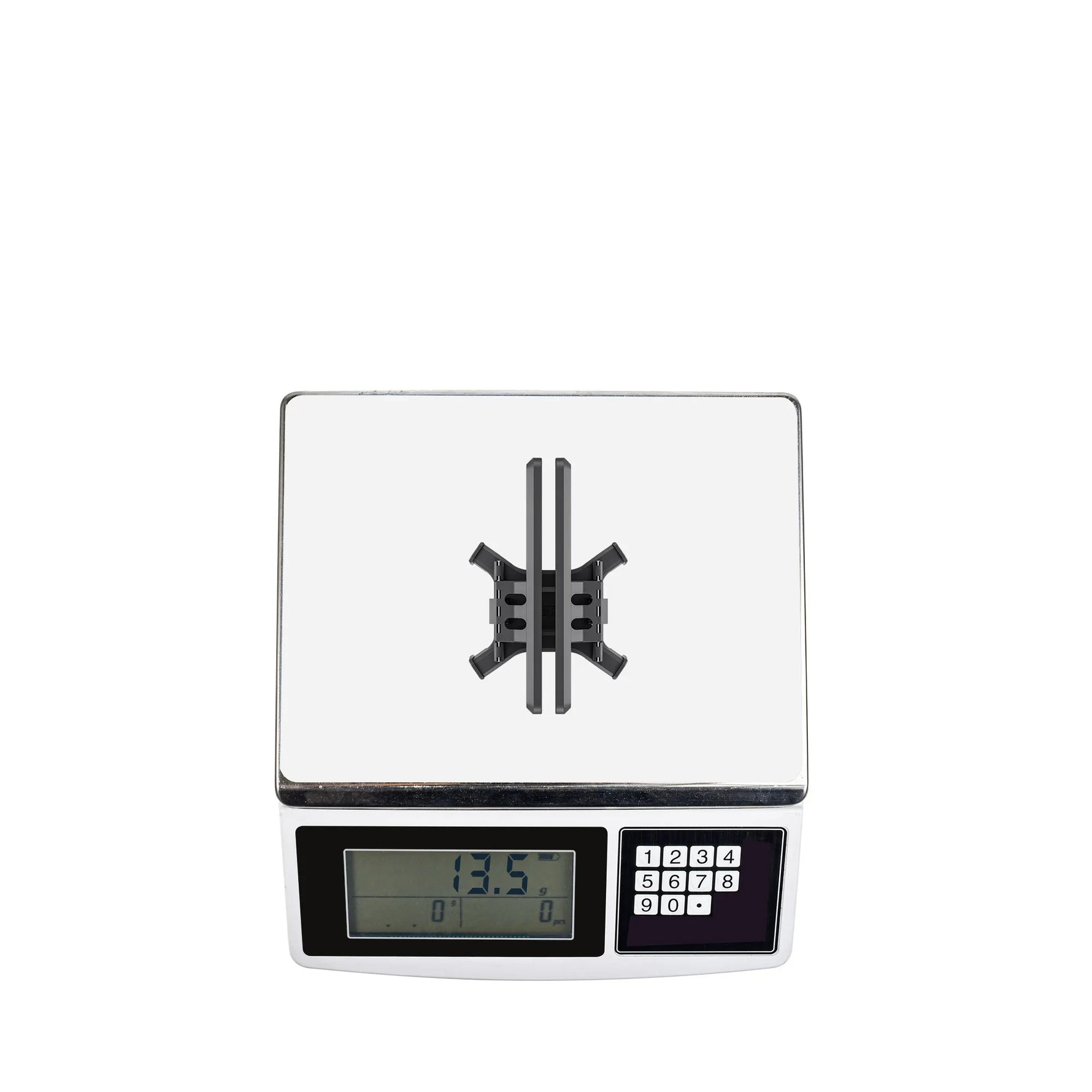 The STARTRC DJI Avata 2 foldable landing gear on a digital scale, highlighting its ultra-lightweight 13.5g design.