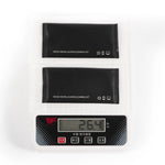 Two pieces of the STARTRC DJI RC screen protectors on a digital scale, proving the lightweight design that adds zero burden to outdoor flight operations.