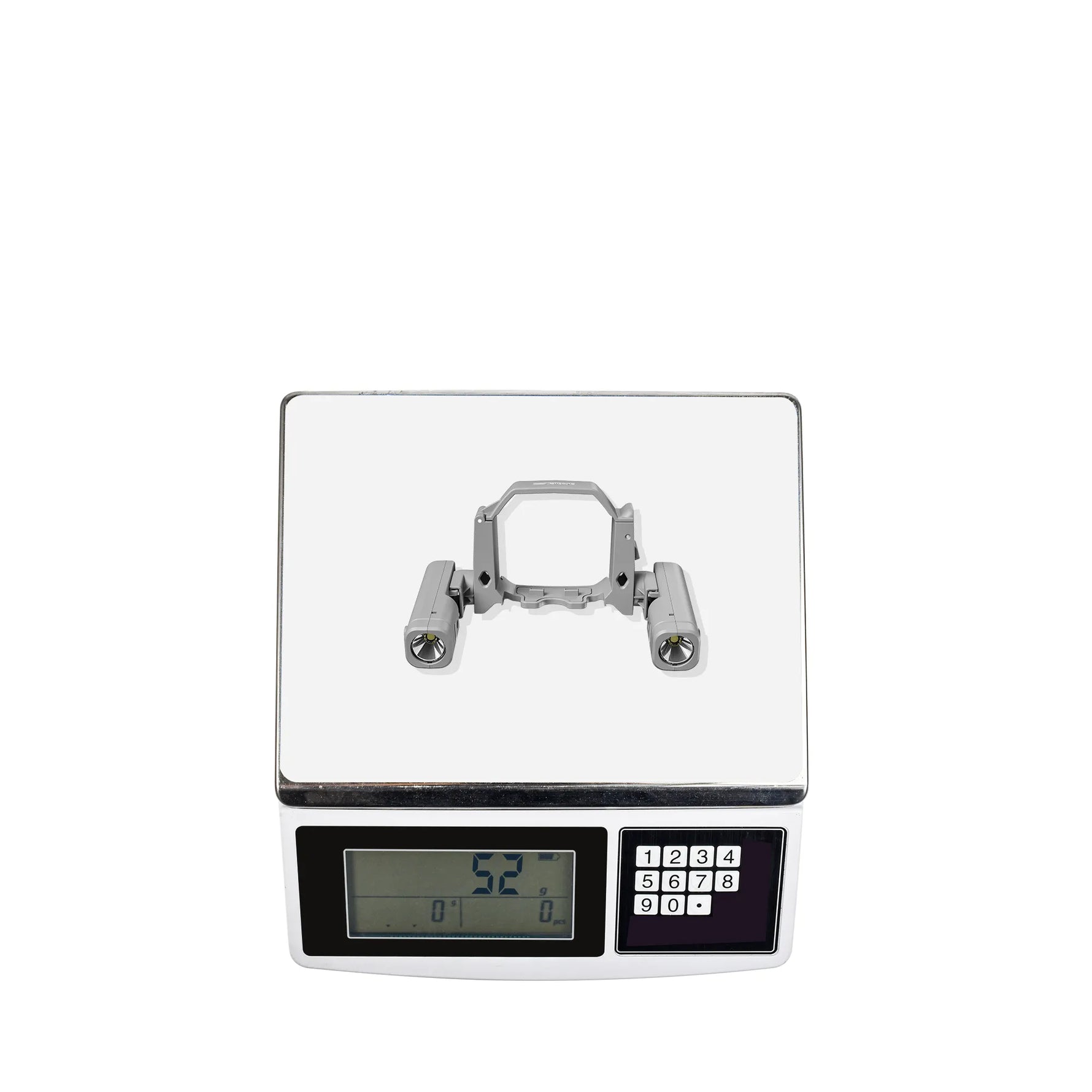 Digital scale displaying the exact 52-gram weight of the drone LED lamp, ensuring negligible impact on your flight time.