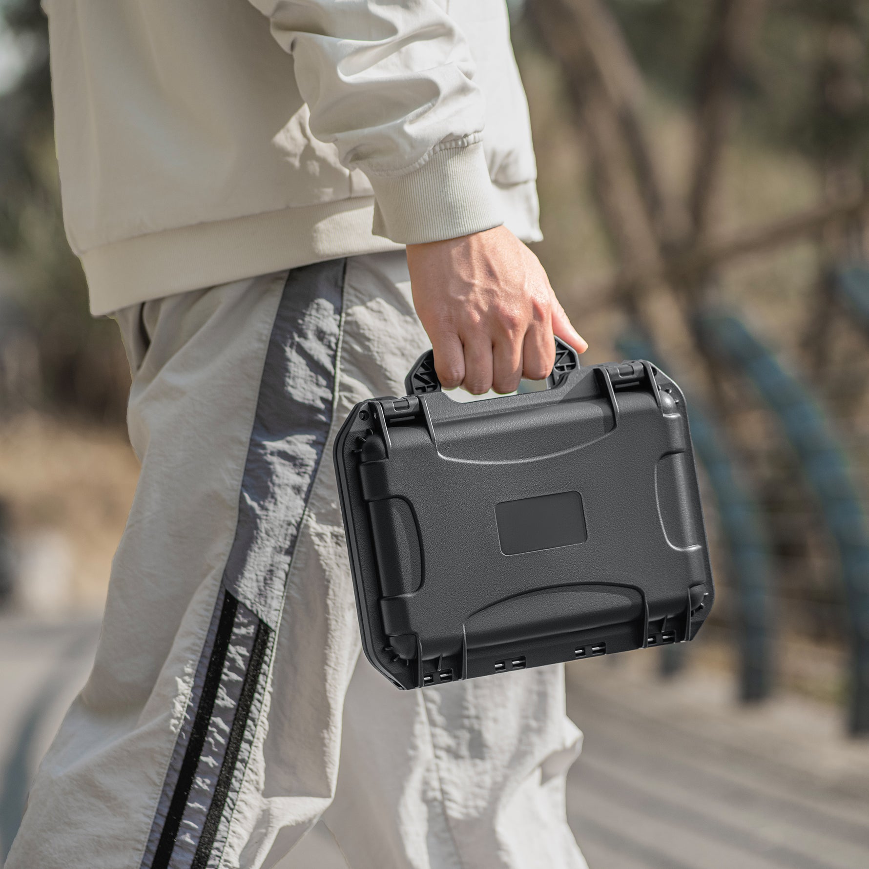 Carrying the highly compact STARTRC DJI Pocket 4 waterproof case outdoors. Armor-level protection with a small footprint for travel vloggers.
