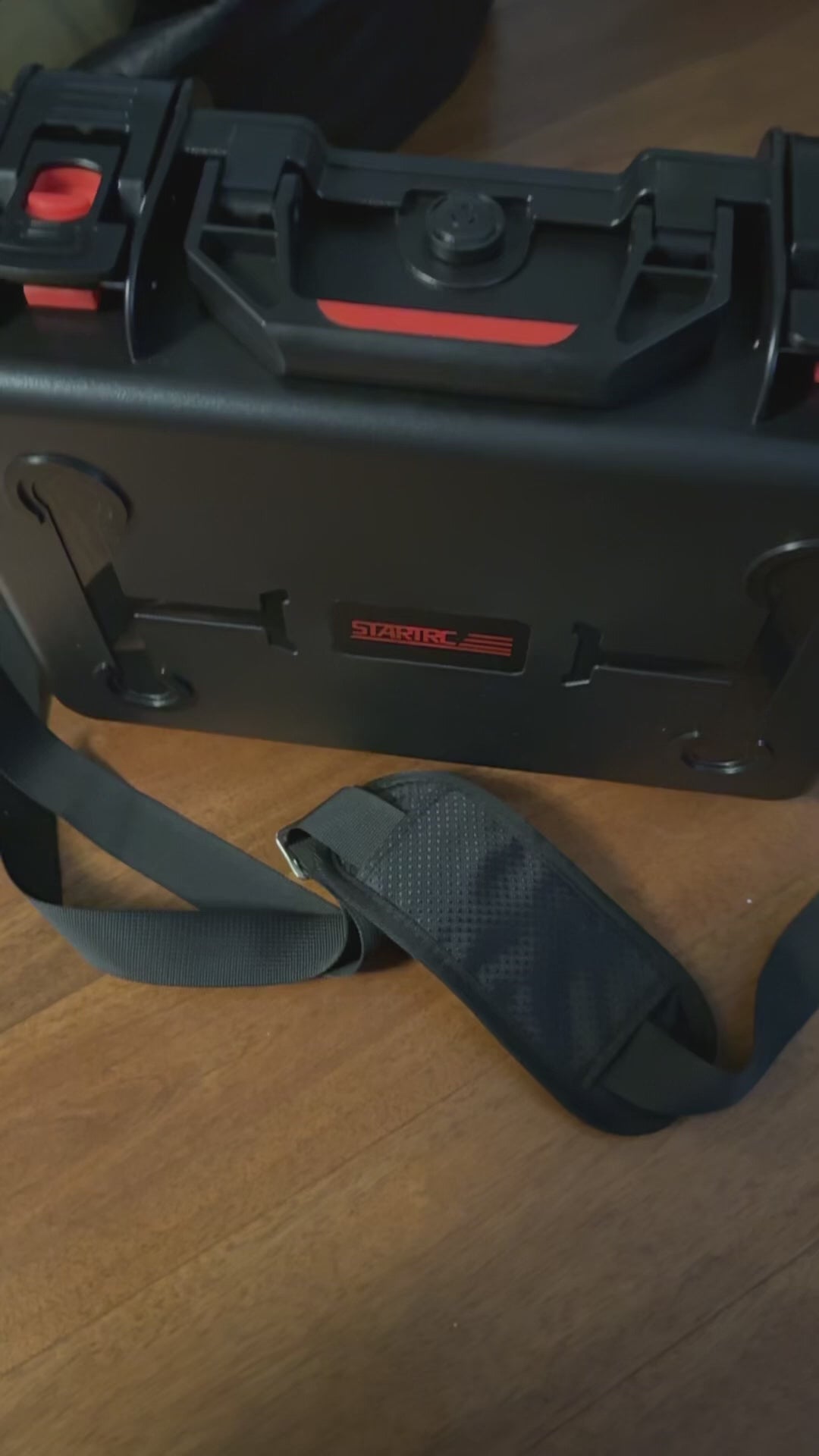 Video thumbnail showing the portable waterproof hard case equipped with a shoulder strap for easy and comfortable carrying during outdoor drone flights.