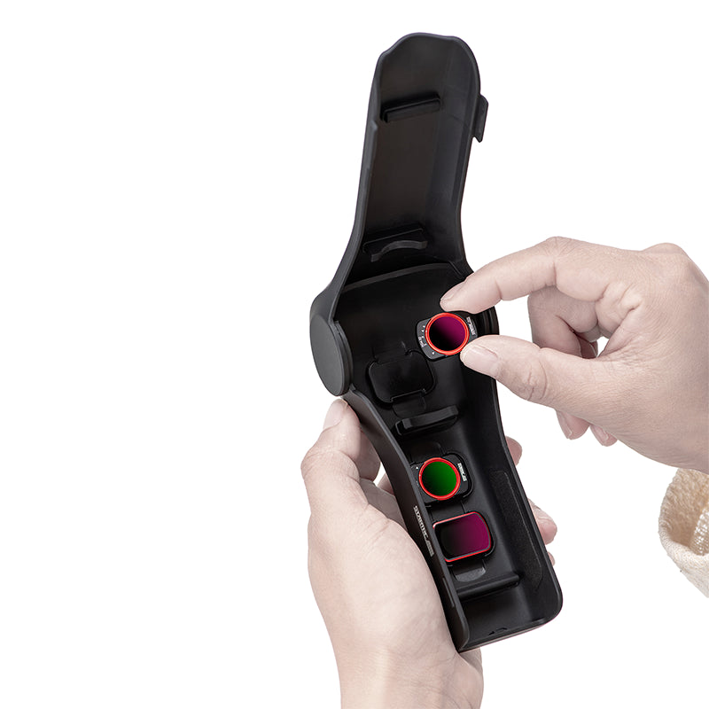 A user accessing the built-in magnetic filter cabin inside the STARTRC protective case, which neatly organizes and stores up to 3 camera filters.